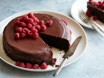 FLOURLESS CHOCOLATE ALMOND CAKE Katie Lee The Kitchen/Early Spring Entertaining Food Network Semisweet Chocolate, Coconut Oil, Almonds, Sugar, Quinoa, Baking Powder, Baking Soda, Cinnamon, Coconut Milk, Eggs, Vanilla Extract, Raspberries